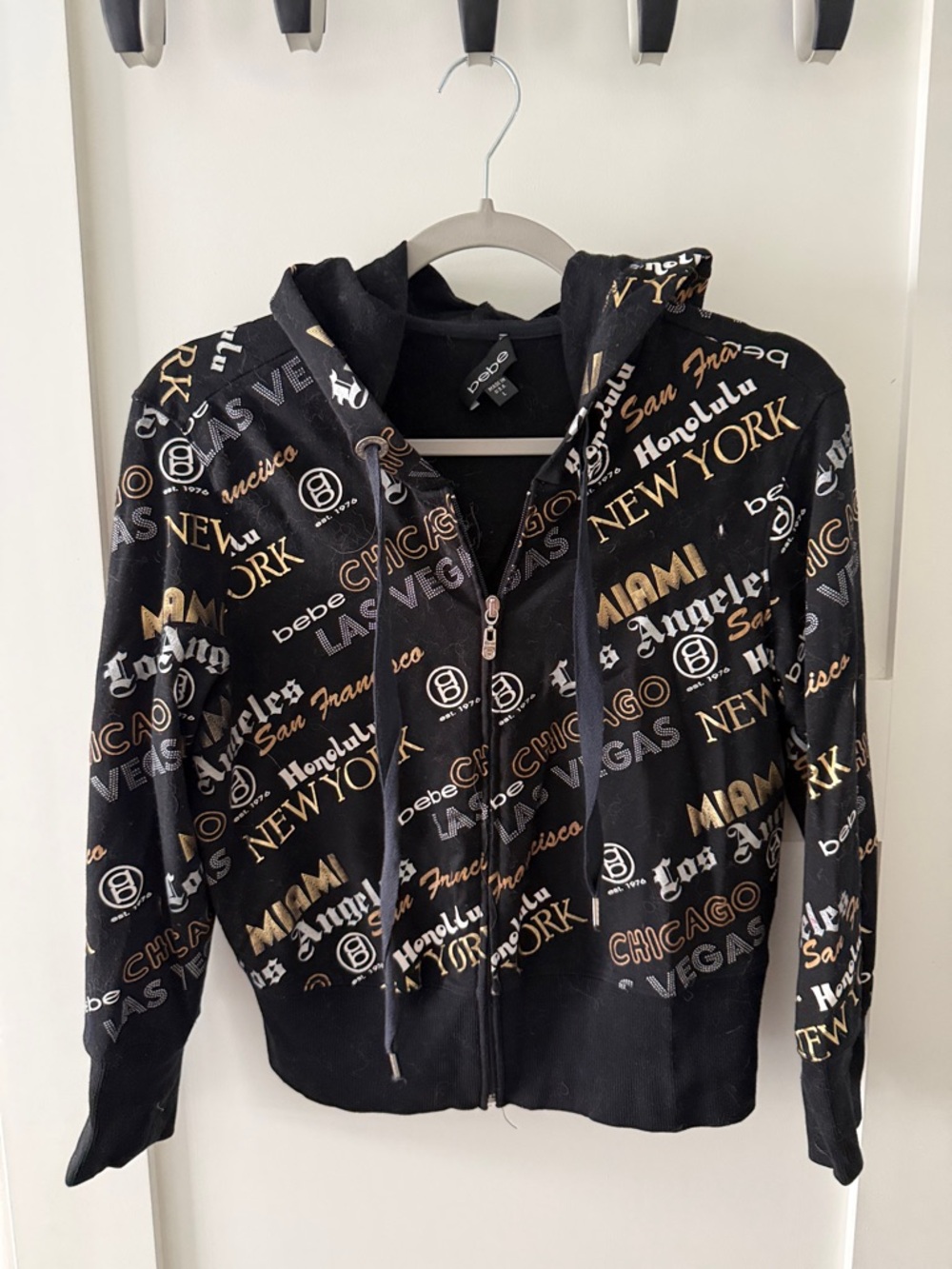 bebe Black Zip Hoodie with Gold & White City Script